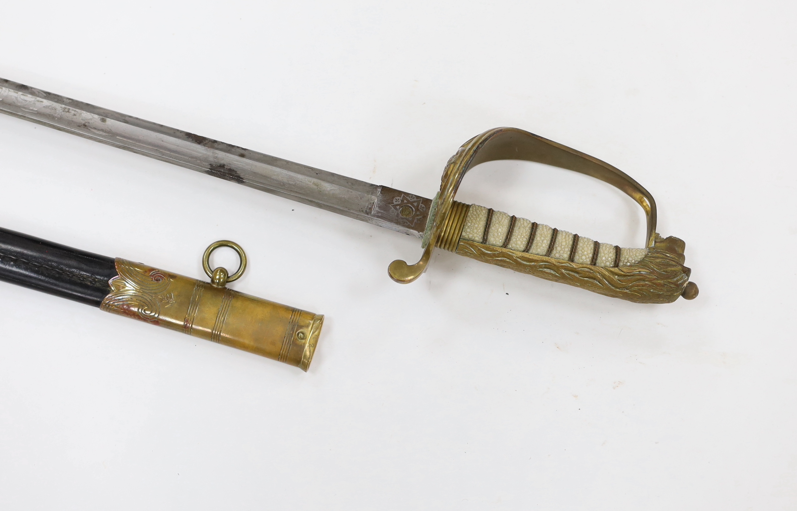 A George V naval officer’s sword, maker Grieves, in a leather scabbard, guard engraved G.P. Bewley, blade 79.5cm, together with outer leather cover